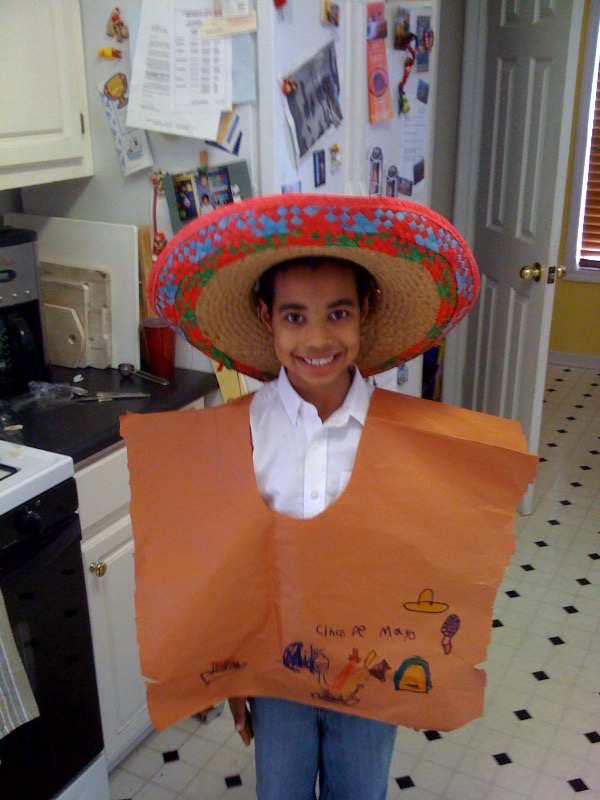 Little Milo in a pncho and sumbrero